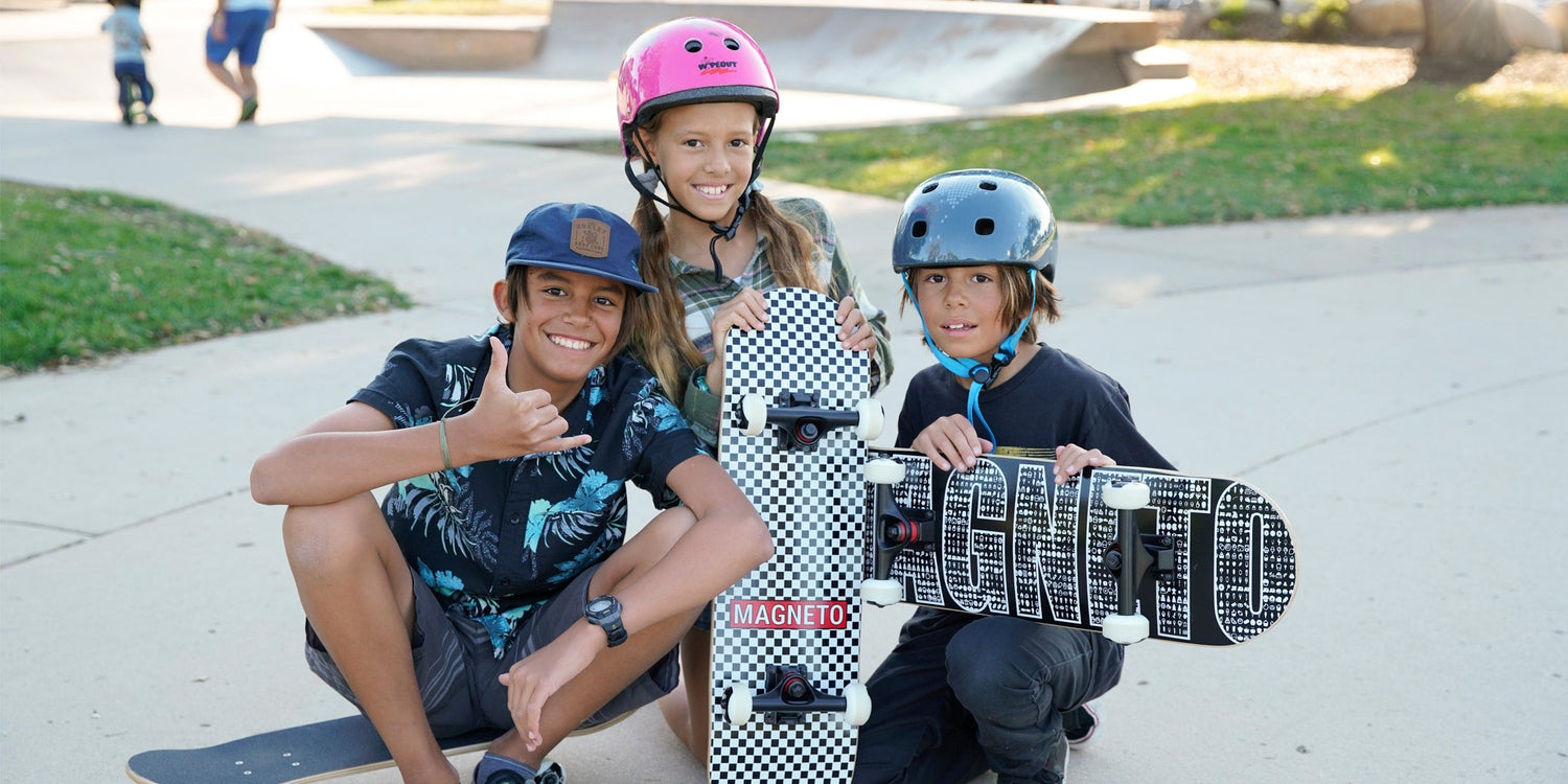 Children holding skateboards